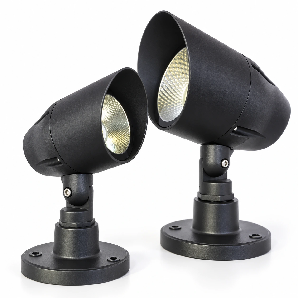 two black visor landscape spotlights with round bases